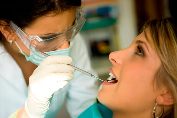 Female-Dentist-Doing-Exam.jpg